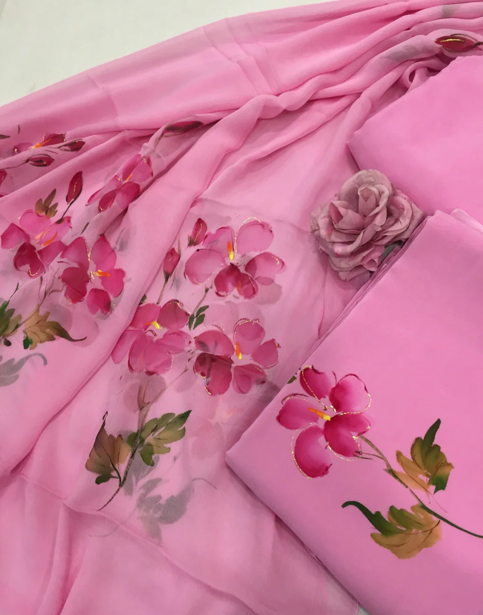 Elegant hand-painted chiffon suit with intricate floral motifs, showcasing luxury fabric and timeless artistry.