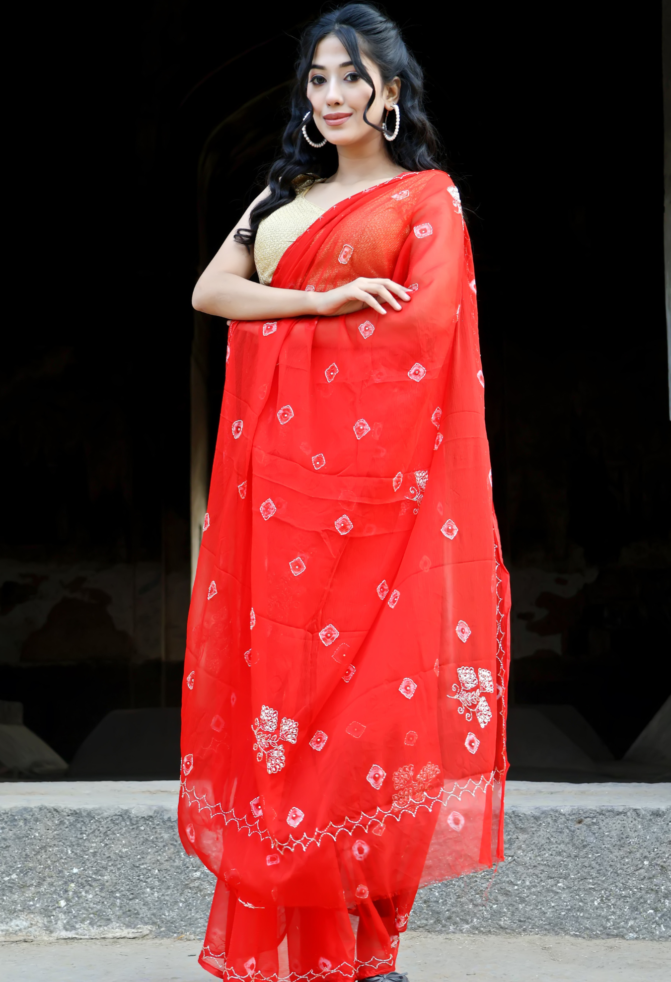 Crimson Red Bandhini saree styled as festive wear, daily wear saree, and party wear saree, a versatile trousseau saree for weddings.