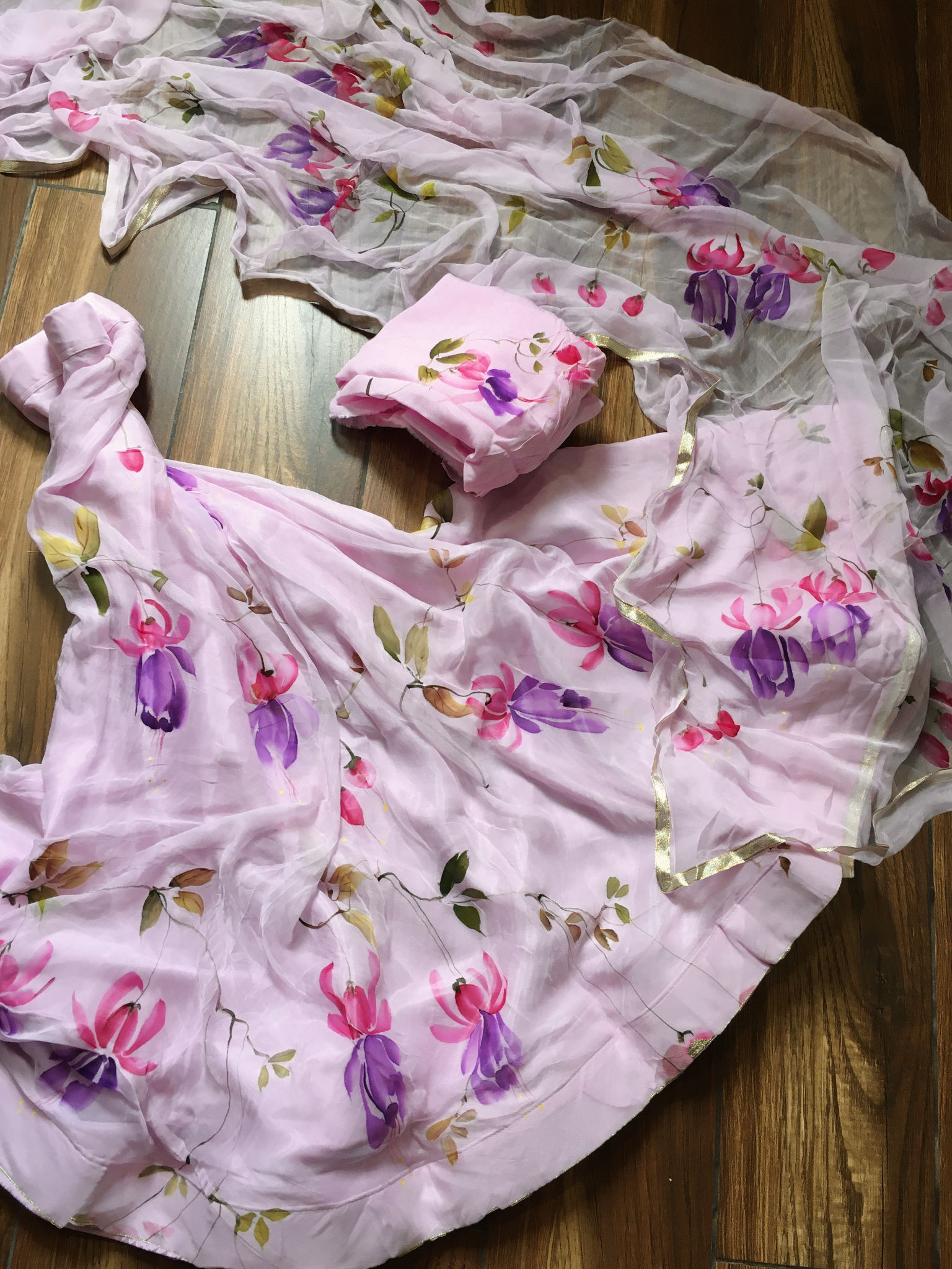 Rich chiffon baby pink saree curated for trousseau saree sets, equally suited for farewell saree and festive wear gatherings.