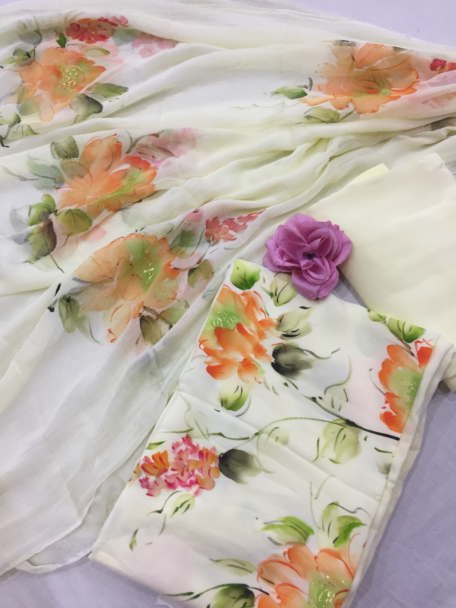 Soft pastel lemon floral chiffon saree with leheriya accents, making it a perfect daily wear saree and elegant festive option.
