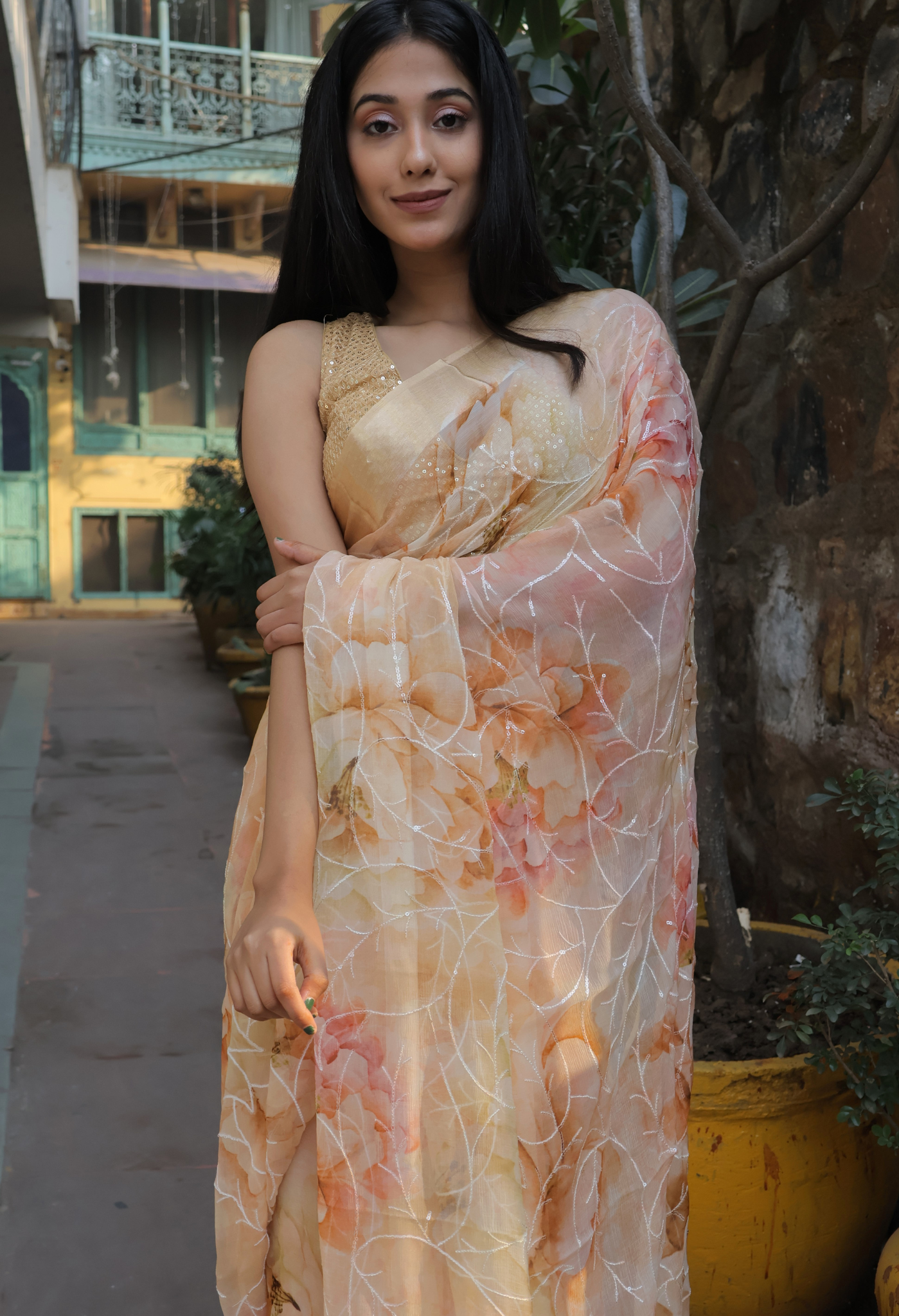 Salmon Peach Embroidered Pure chiffon saree styled as festive wear, daily wear saree, and party wear saree, a versatile trousseau saree for weddings.
