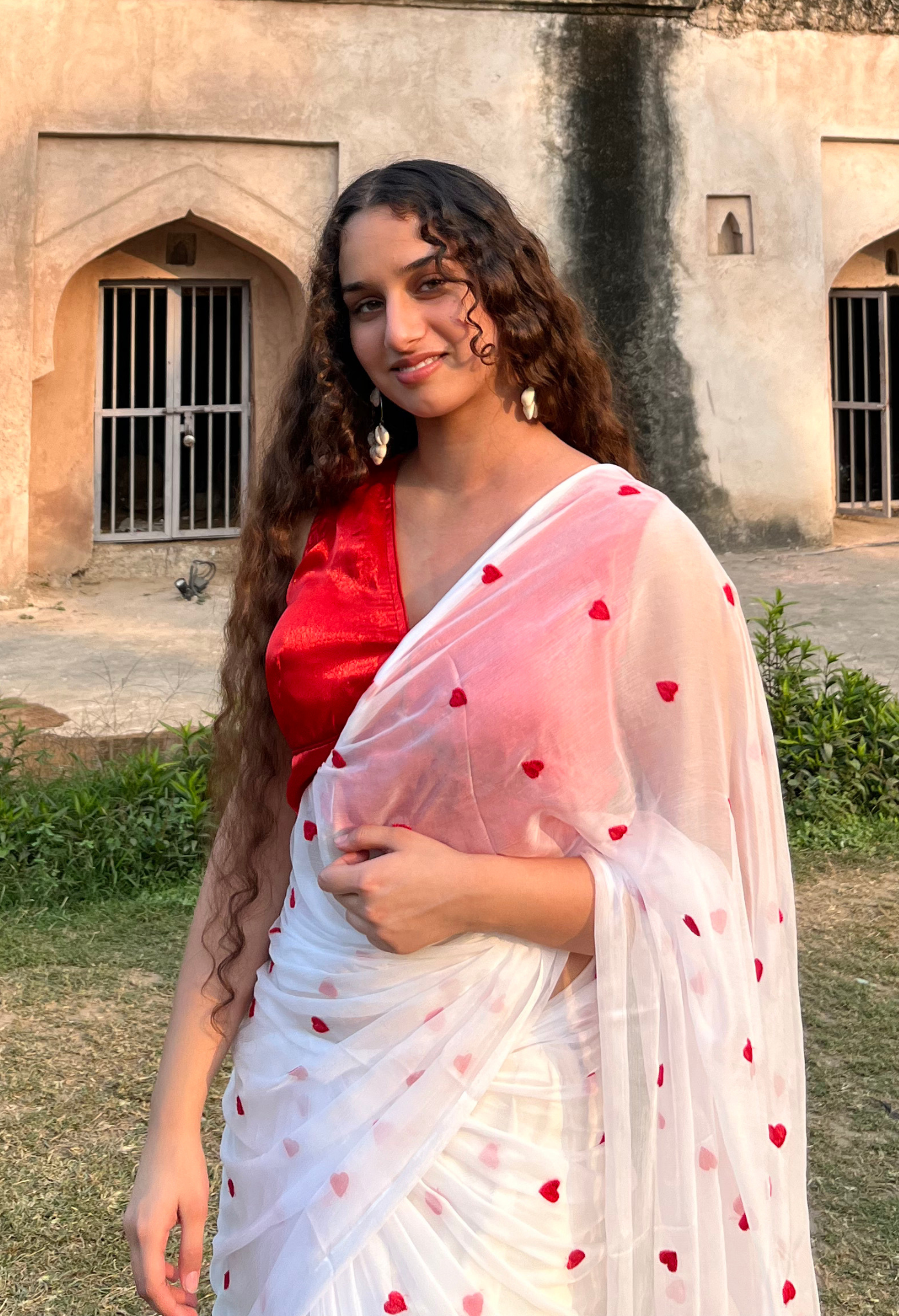 Red Heart Embroidered Sophisticated chiffon saree designed for festive wear, pre-wedding collection, versatile as party wear saree and trousseau saree.