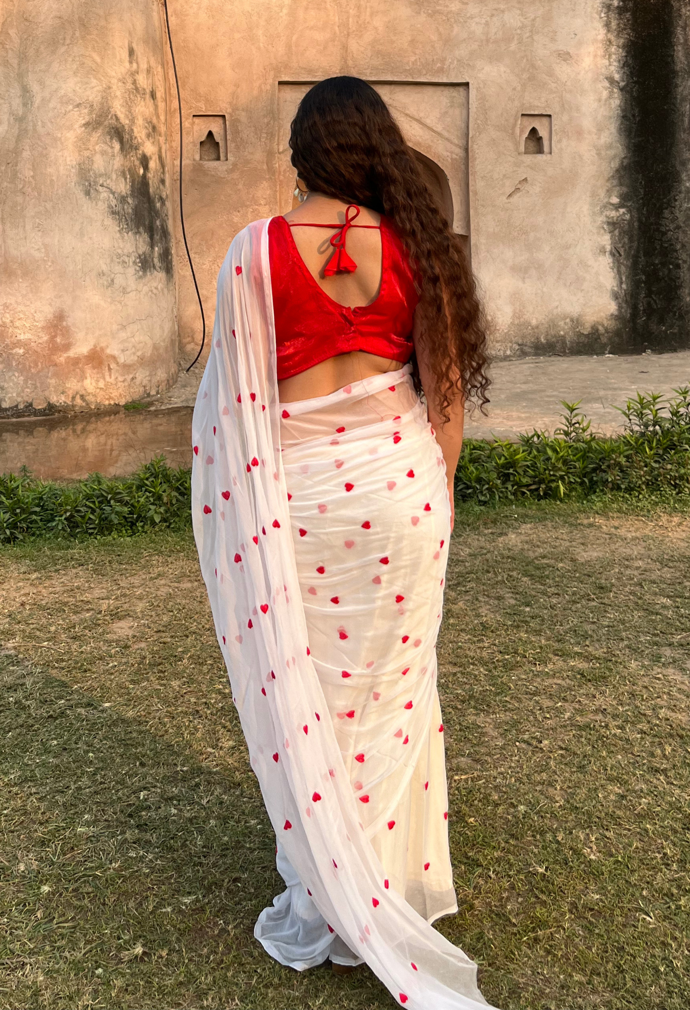 Red Heart Embroidered Sophisticated chiffon saree designed for festive wear, pre-wedding collection, versatile as party wear saree and trousseau saree.
