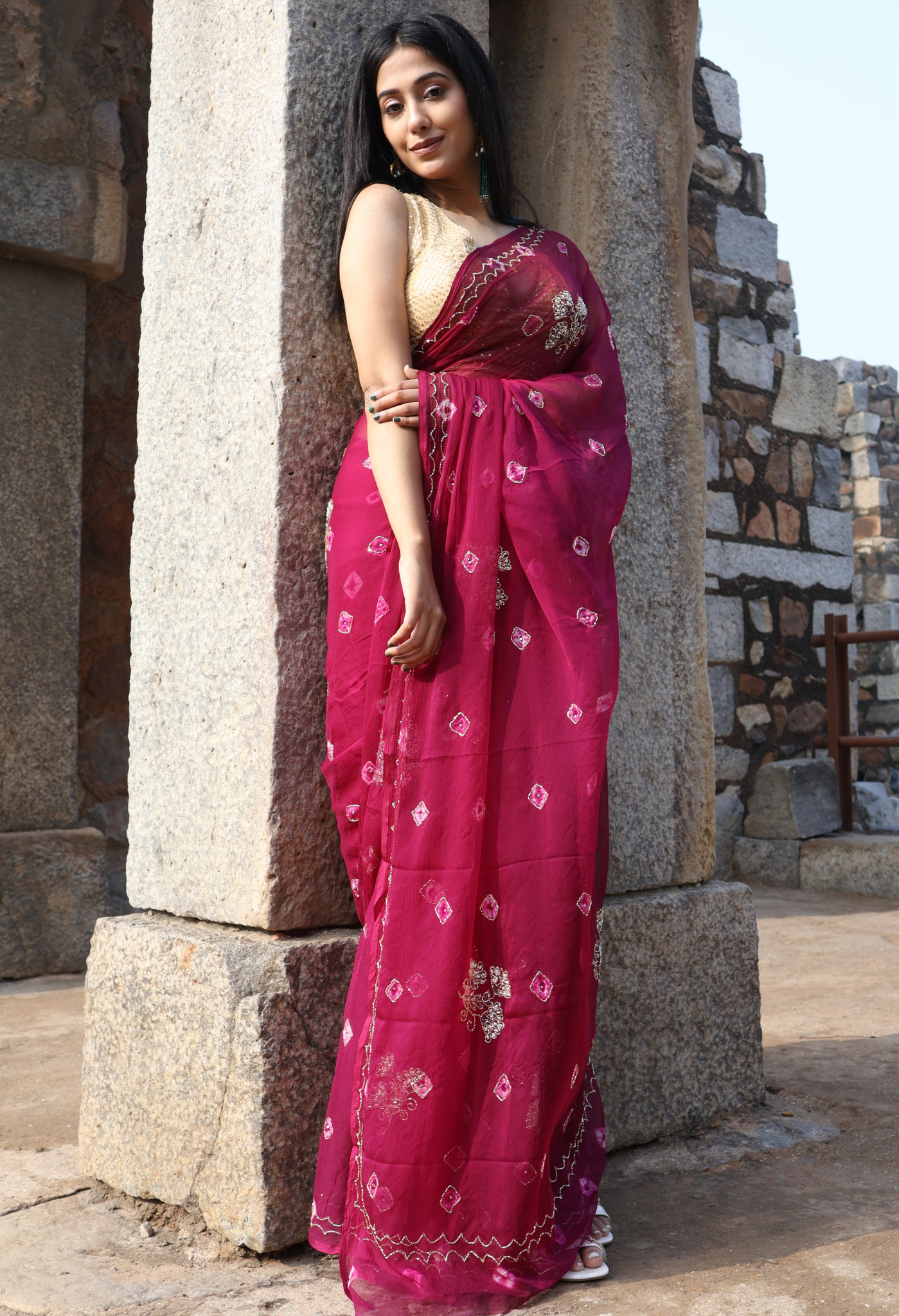 Burgundy Bandhini Embellished chiffon leheriya saree for festive wear, trousseau saree, or farewell saree for timeless pre-wedding collection looks.