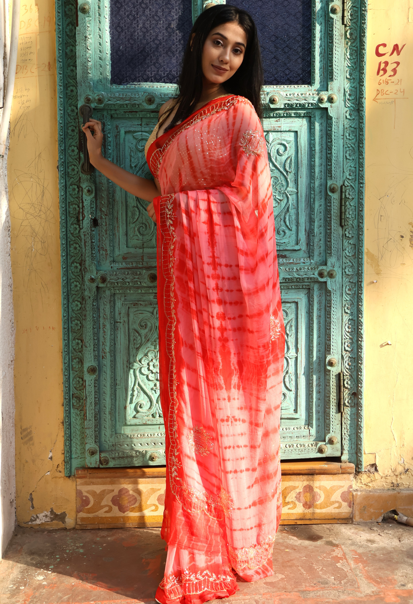 Coral Red Shibori Dye chiffon leheriya saree for festive wear, trousseau saree, or farewell saree for timeless pre-wedding collection looks.