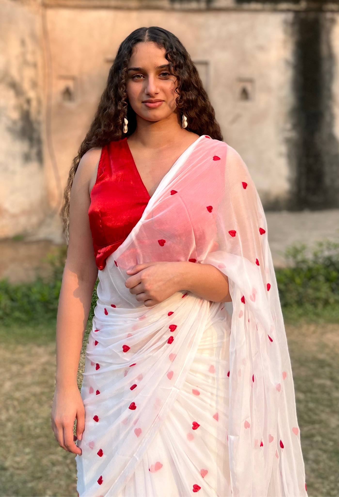 Red Heart Embroidered Sophisticated chiffon saree designed for festive wear, pre-wedding collection, versatile as party wear saree and trousseau saree.