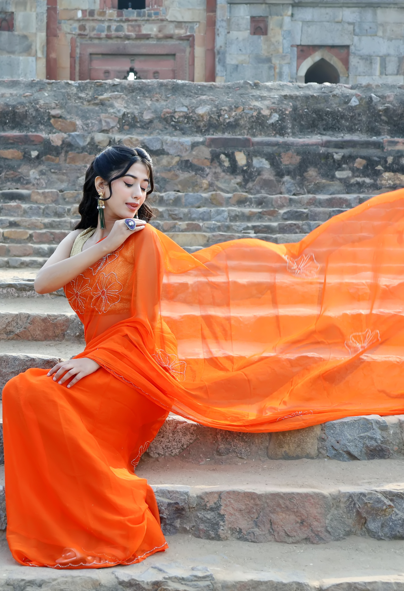 Elegant Princeton Orange Embellished chiffon leheriya saree for festive wear, trousseau saree, or farewell saree for timeless pre-wedding collection looks.