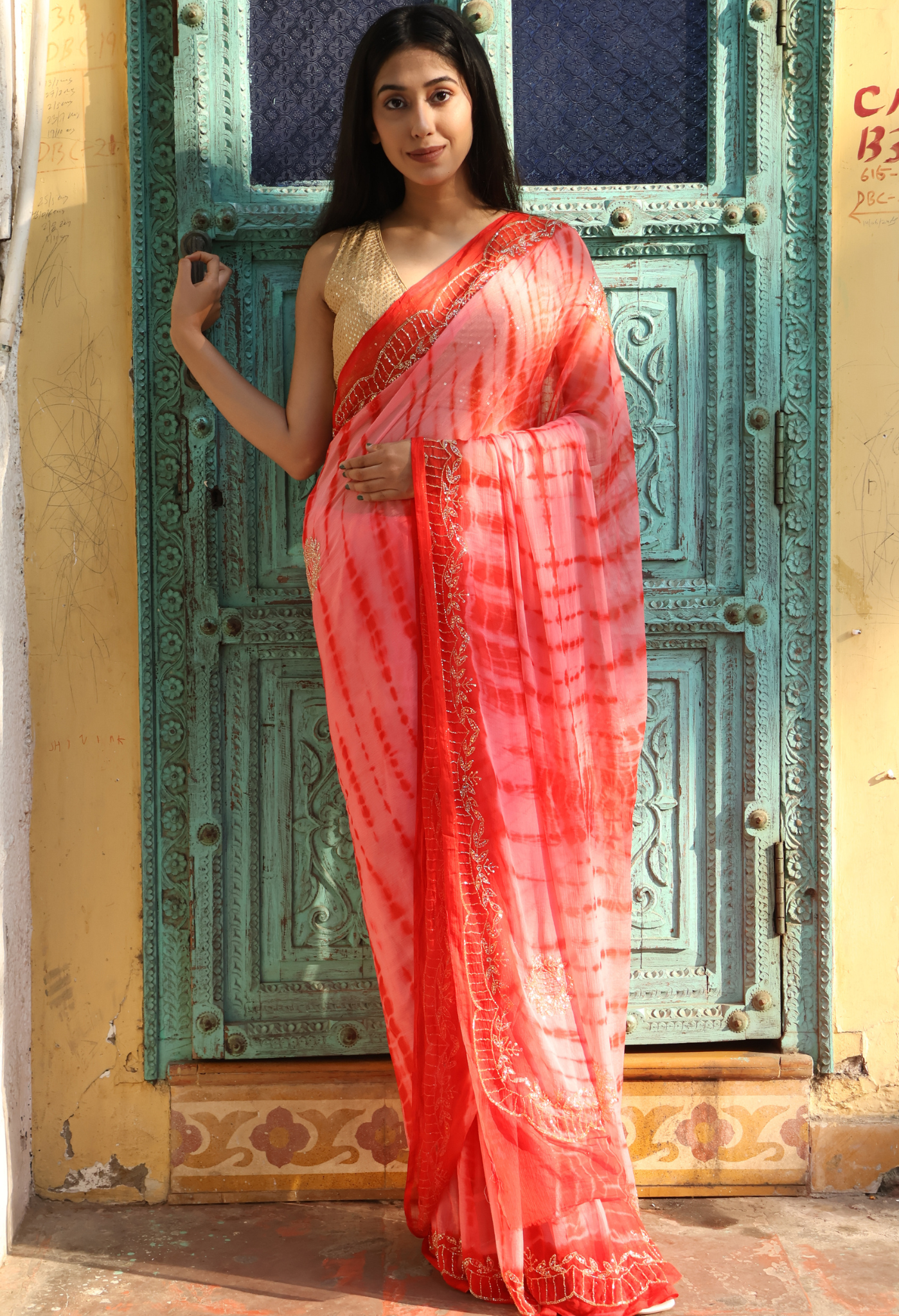 Coral Red Shibori Dye chiffon leheriya saree for festive wear, trousseau saree, or farewell saree for timeless pre-wedding collection looks.