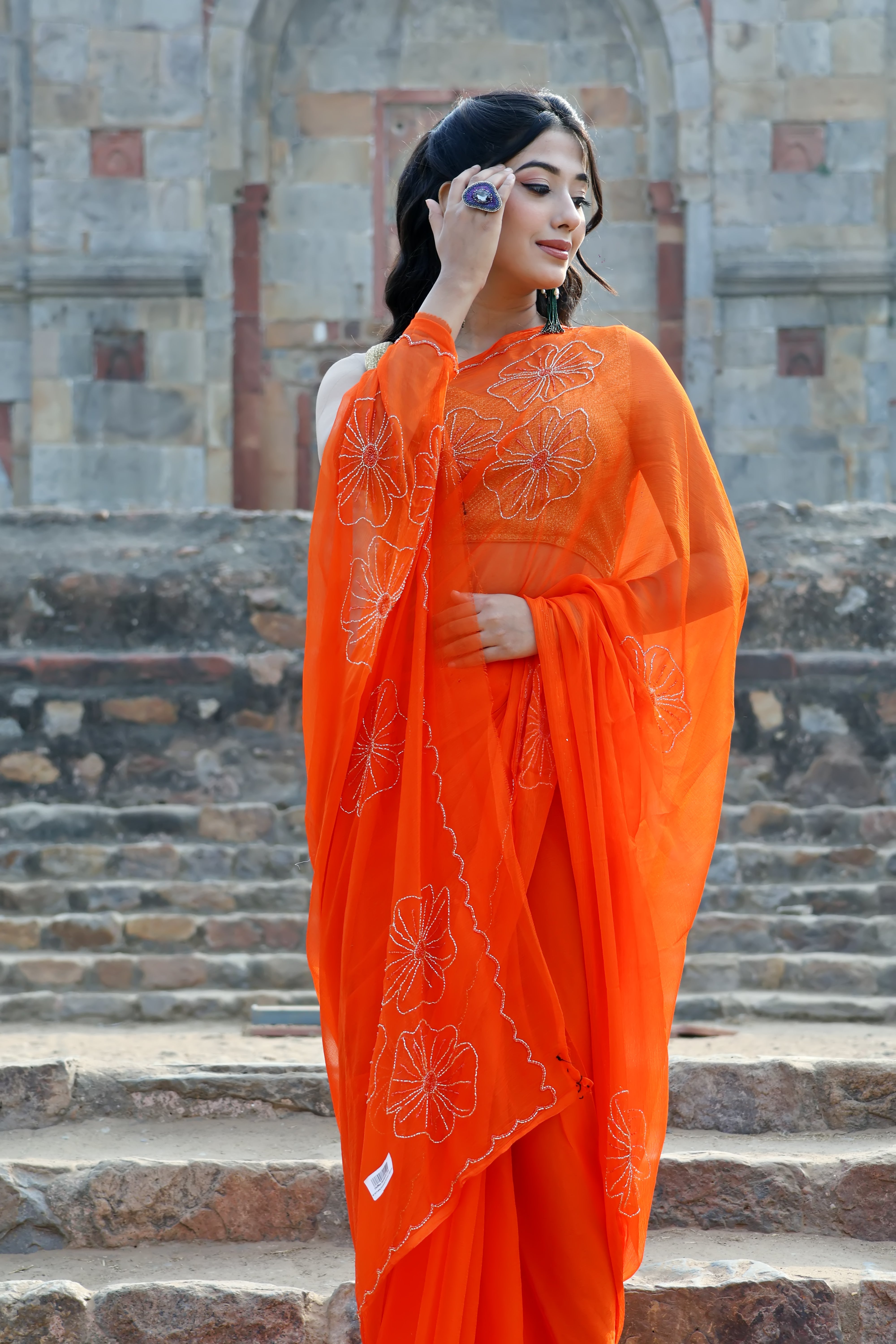 Elegant Princeton Orange Embellished chiffon leheriya saree for festive wear, trousseau saree, or farewell saree for timeless pre-wedding collection looks.